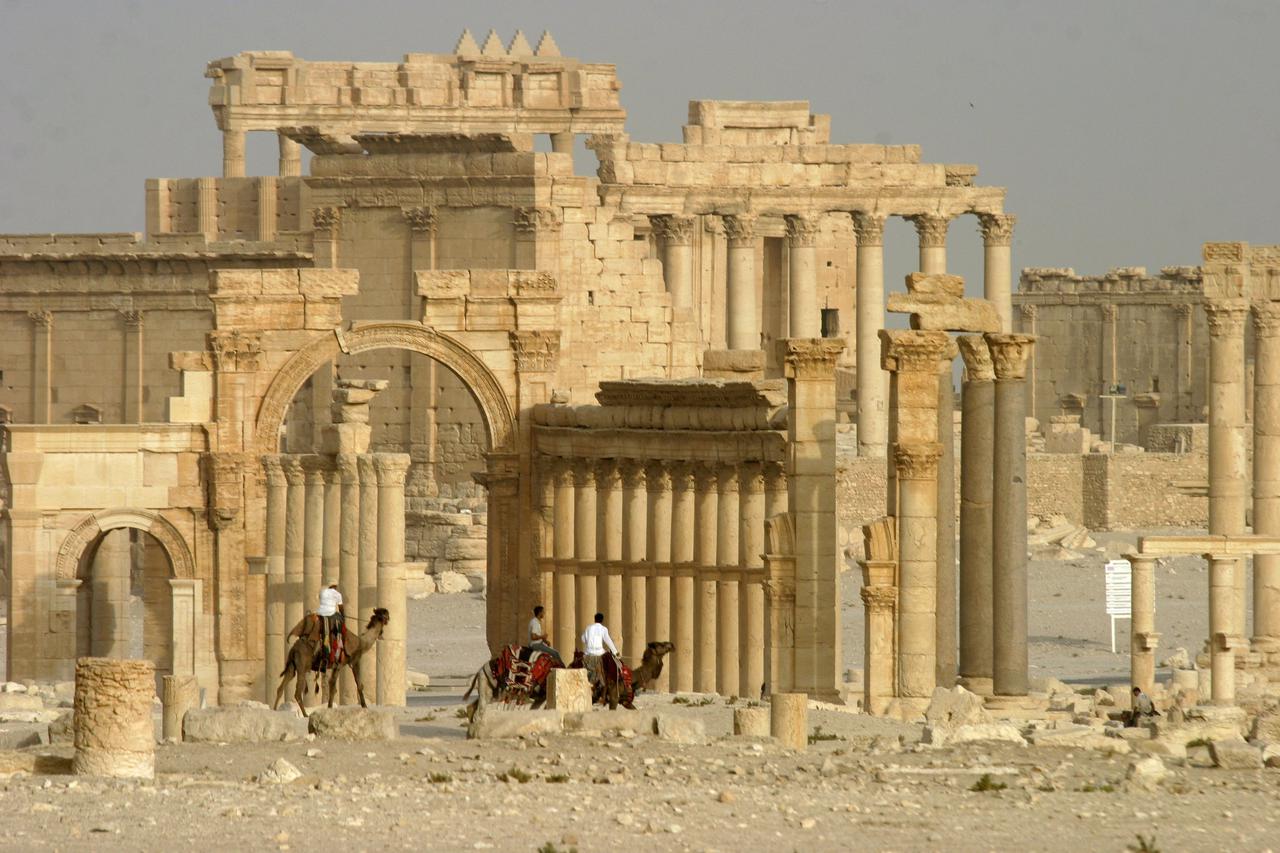 Columns and the ancient Temple of Bel are seen in the historical city of Palmyra, Syria, June 11, 2009. Satellite images have confirmed the destruction of the Temple of Bel, which was one of the best preserved Roman-era sites in the Syrian city of Palmyra