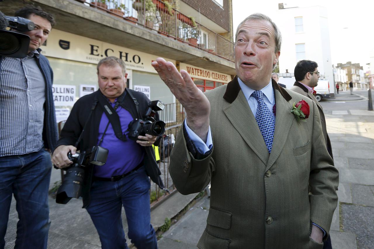 Nigel Farage, leader of the United Kingdom Independence Party (UKIP), leaves after voting at his polling station in Ramsgate, southeast England, May 7, 2015. REUTERS/Suzanne Plunkett      TPX IMAGES OF THE DAY