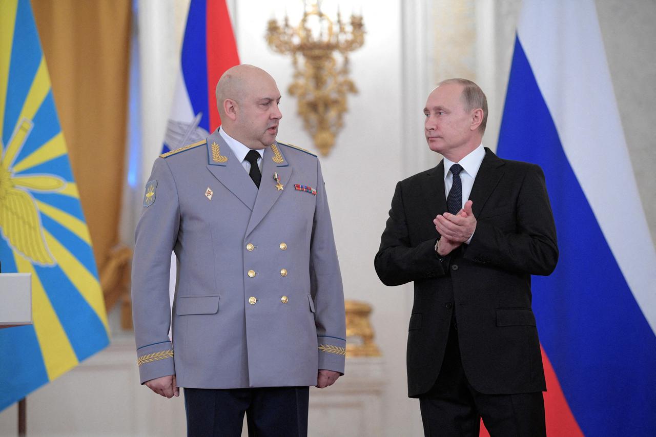 FILE PHOTO: FILE PHOTO: Russian President Vladimir Putin and Colonel General Sergei Surovikin, commander of Russian forces in Syria, attend a state awards ceremony for military personnel who served in Syria, at the Kremlin in Moscow