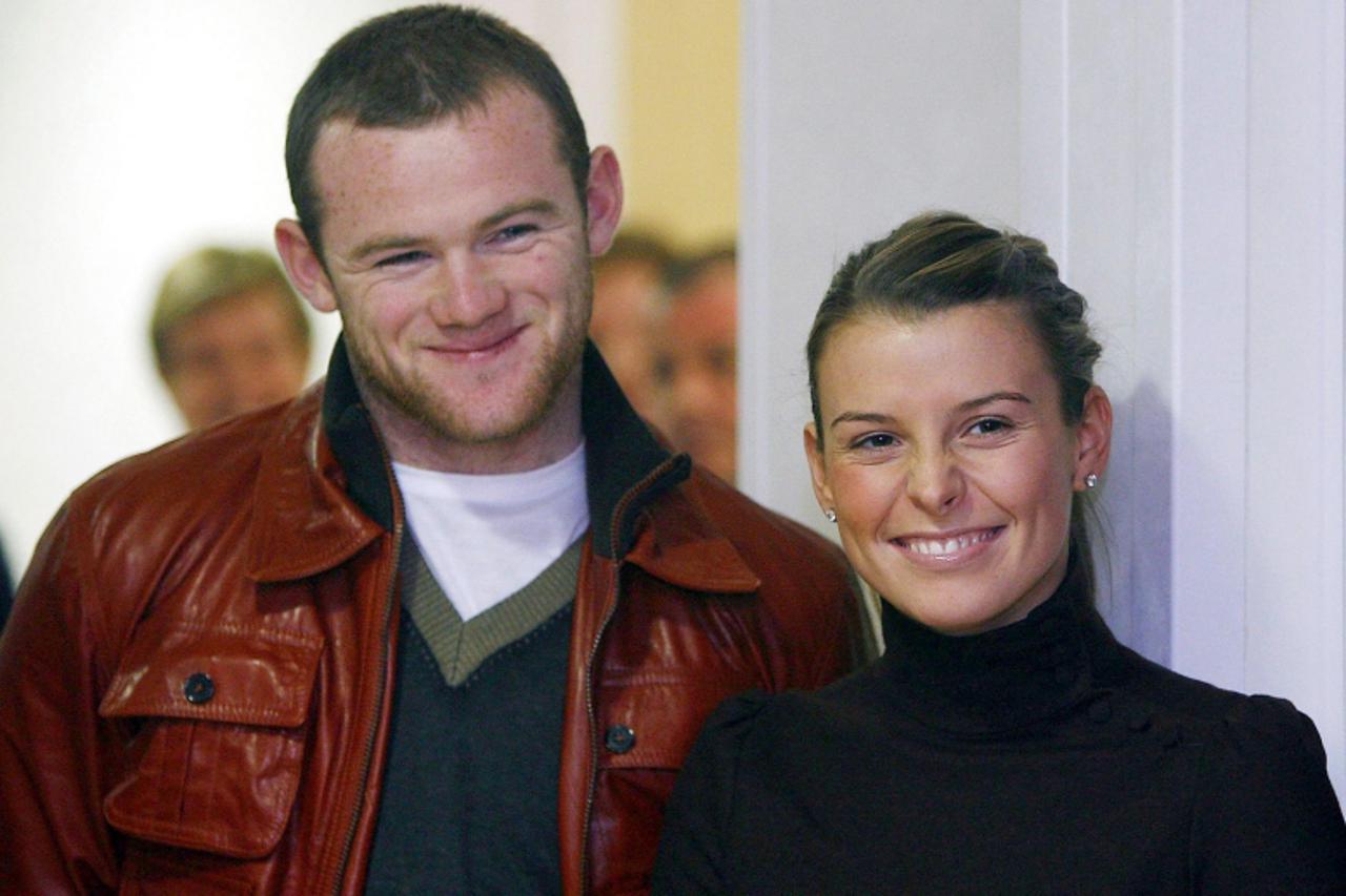 'File photo dated 04/12/2006 of Wayne Rooney and Coleen McLoughlin, who are expecting their first child, it was reported today.'