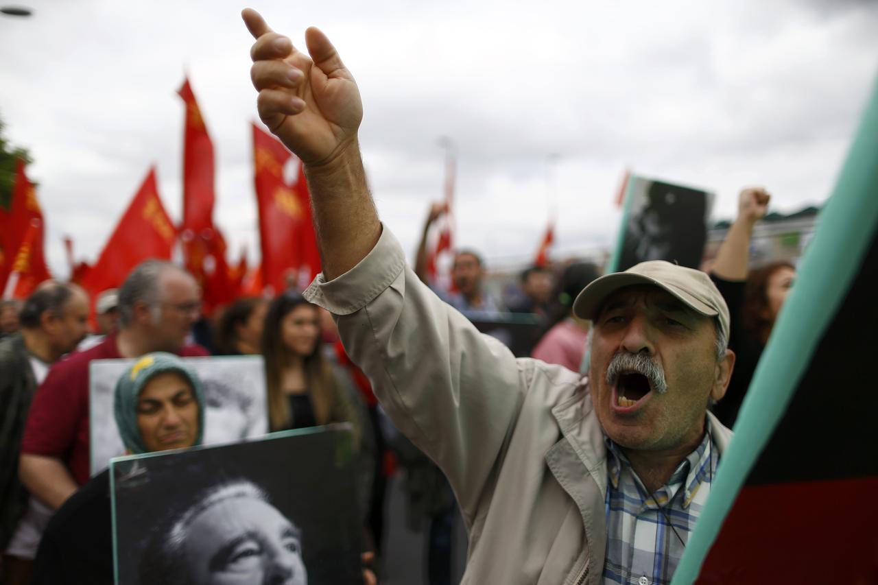 A man gestures as he walks during May Day demonstrations in Istanbul, Turkey, May 1, 2016.     REUTERS/Osman Orsal