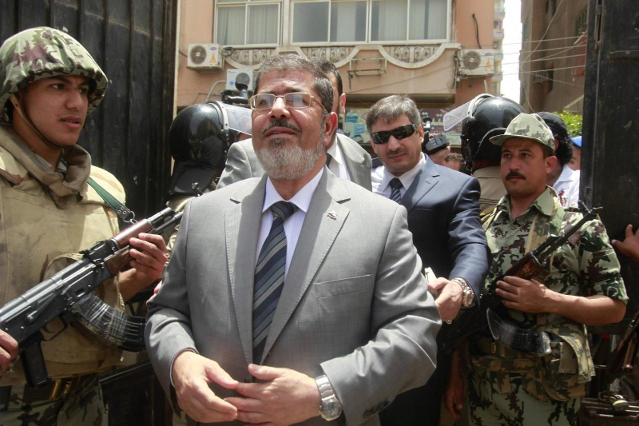 'Islamic presidential candidate Mohamed Mursi arrives at a polling station to cast his vote in Al-Sharqya, 60 km (37 miles) northeast of Cairo, in this May 23, 2012 file photo. Egypt\'s deposed Presid