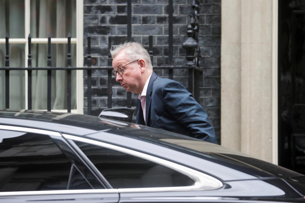 Britain's Chancellor of the Duchy of Lancaster Michael Gove  walks outside Downing Street, in London