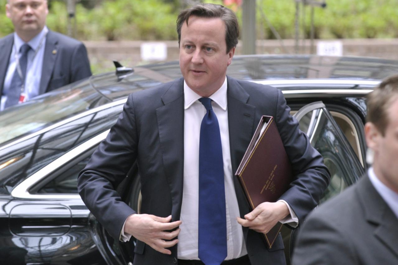 'Britain\'s Prime Minister David Cameron arrives at a European Union leaders summit in Brussels May 22, 2013. Growing concern in European capitals about aggressive tax avoidance by high-profile corpor