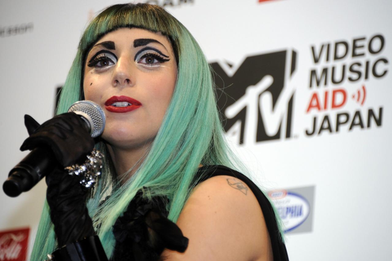 'US top entertainer Lady Gaga delivers a message during a press conference of the MTV video Music Aid Japan event in Tokyo on June 23, 2011.  Lady Gaga is here to  attend a charity music event for the