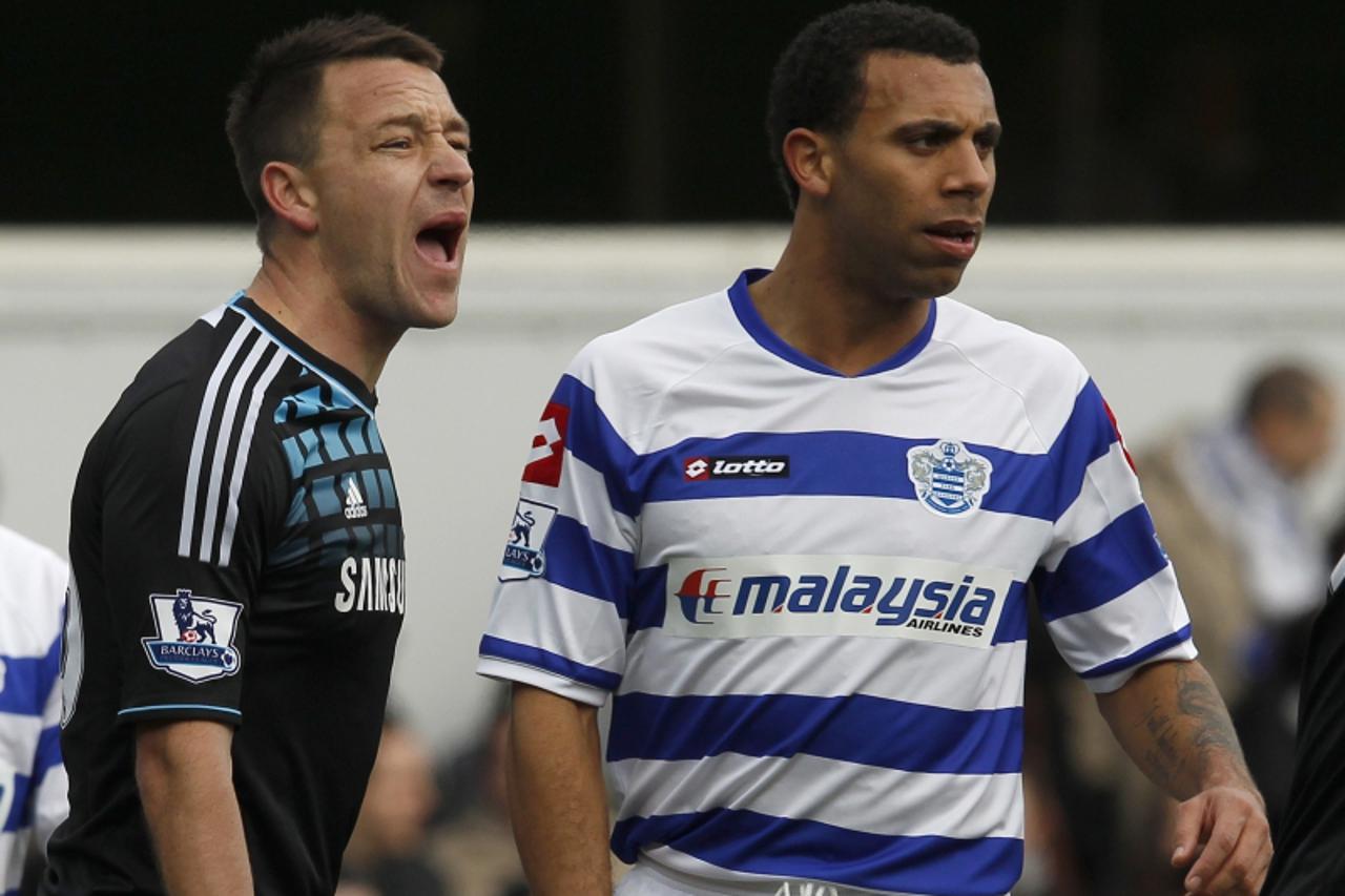 'Queens Park Rangers\' Anton Ferdinand (R) is marked by Chelsea\'s John Terry before a corner kick during their FA Cup soccer match at Loftus Road in London January 28, 2012.   REUTERS/Eddie Keogh (BR