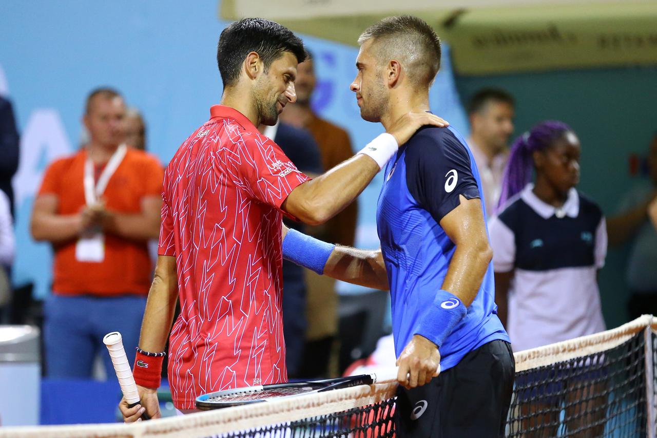Serbia's Novak Djokovic greets with Croatia's Borna Coric after winning his match in Zadar