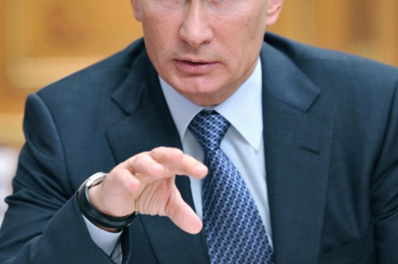 'Russia\'s Prime Minister Vladimir Putin speaks as he chairs a meeting in Moscow, on September 15, 2011. AFP PHOTO/ RIA-NOVOSTI/ALEXEI NIKOLSKY'
