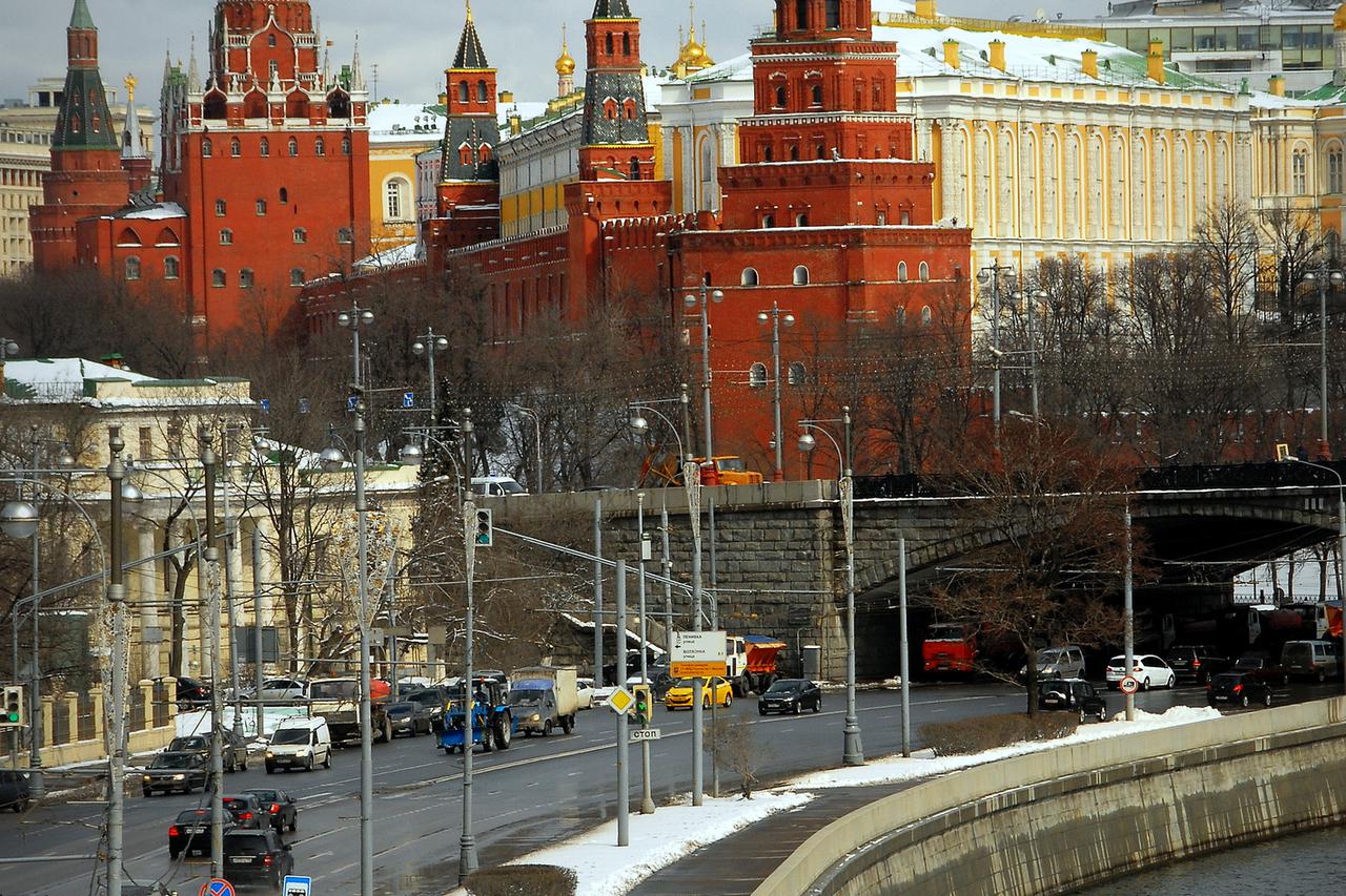 Moscow Kremlin tower, quay and river.