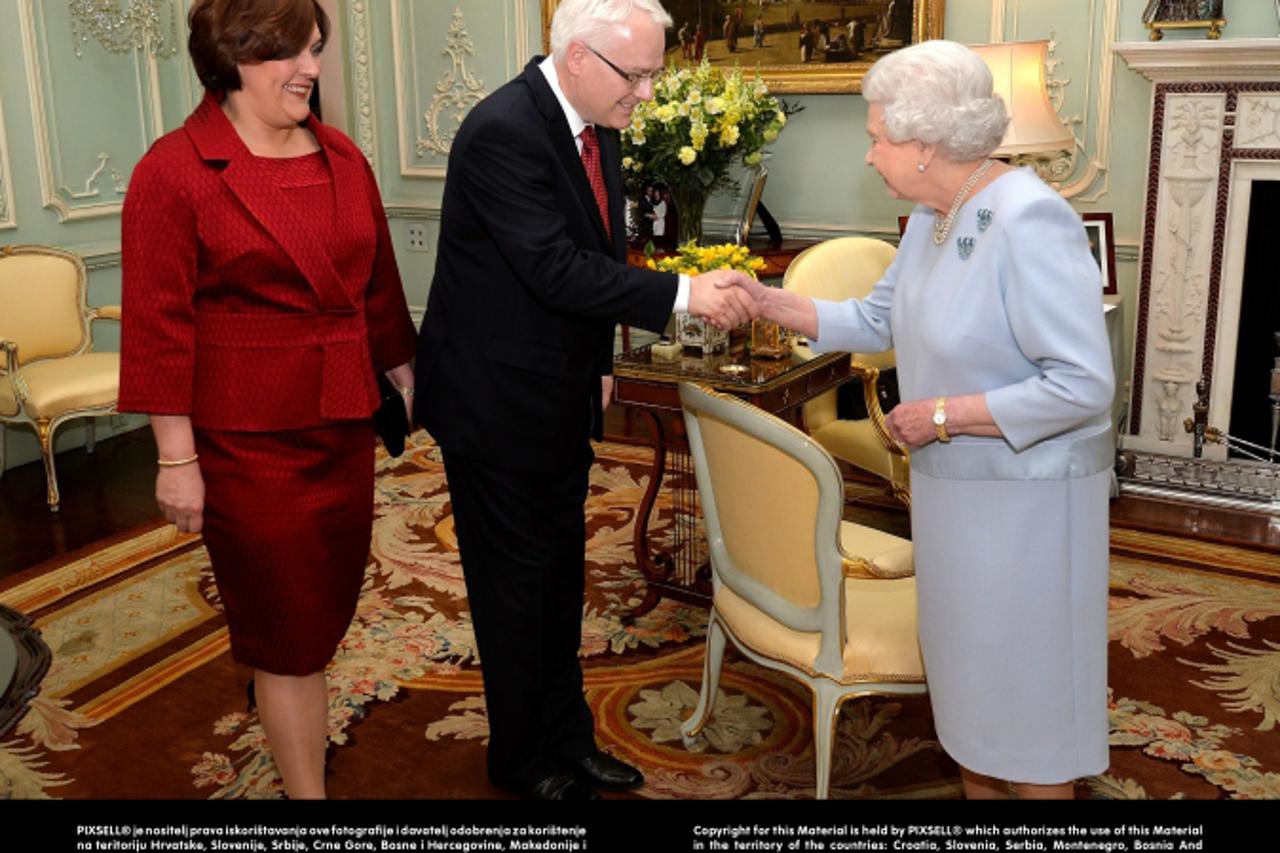 'Queen Elizabeth II greets the President of Croatia Mr Ivo Josipovic, as he is accompanied by his wife Tatiana to a private audience at Buckingham Palace in central London.Photo: Press Association/PIX