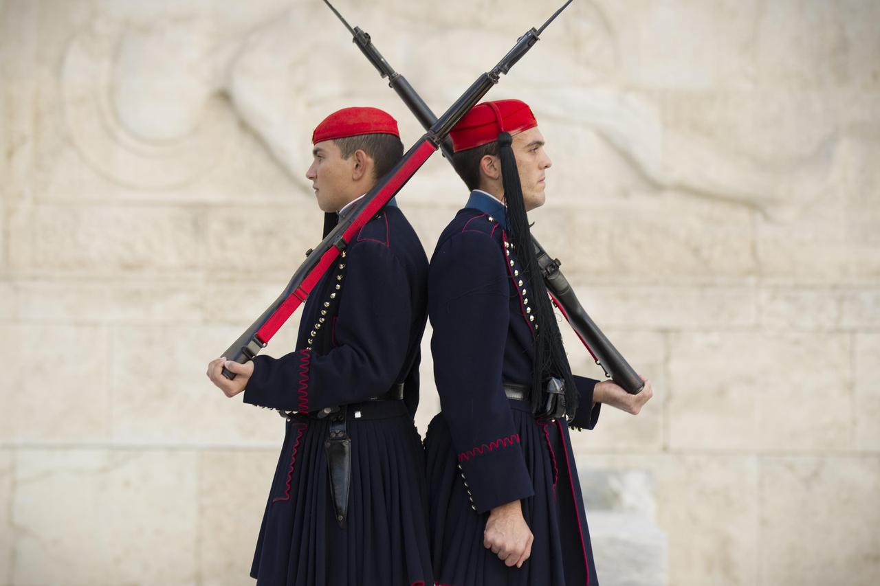 Guards perform their ceremonial march during the hourly changing of the guard at Greece's parliament in Athens, Thursday. Prime Minister Papandreou was under pressure to resign throughout the day. Credit: The Times. Online rights must be cleared by N.I.Sy