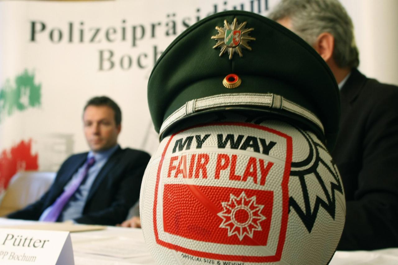 'A ball with a police cap is seen during a news conference in Bochum November 20, 2009. Police in Germany and abroad have made several arrests and conducted searches on suspicion of an international i