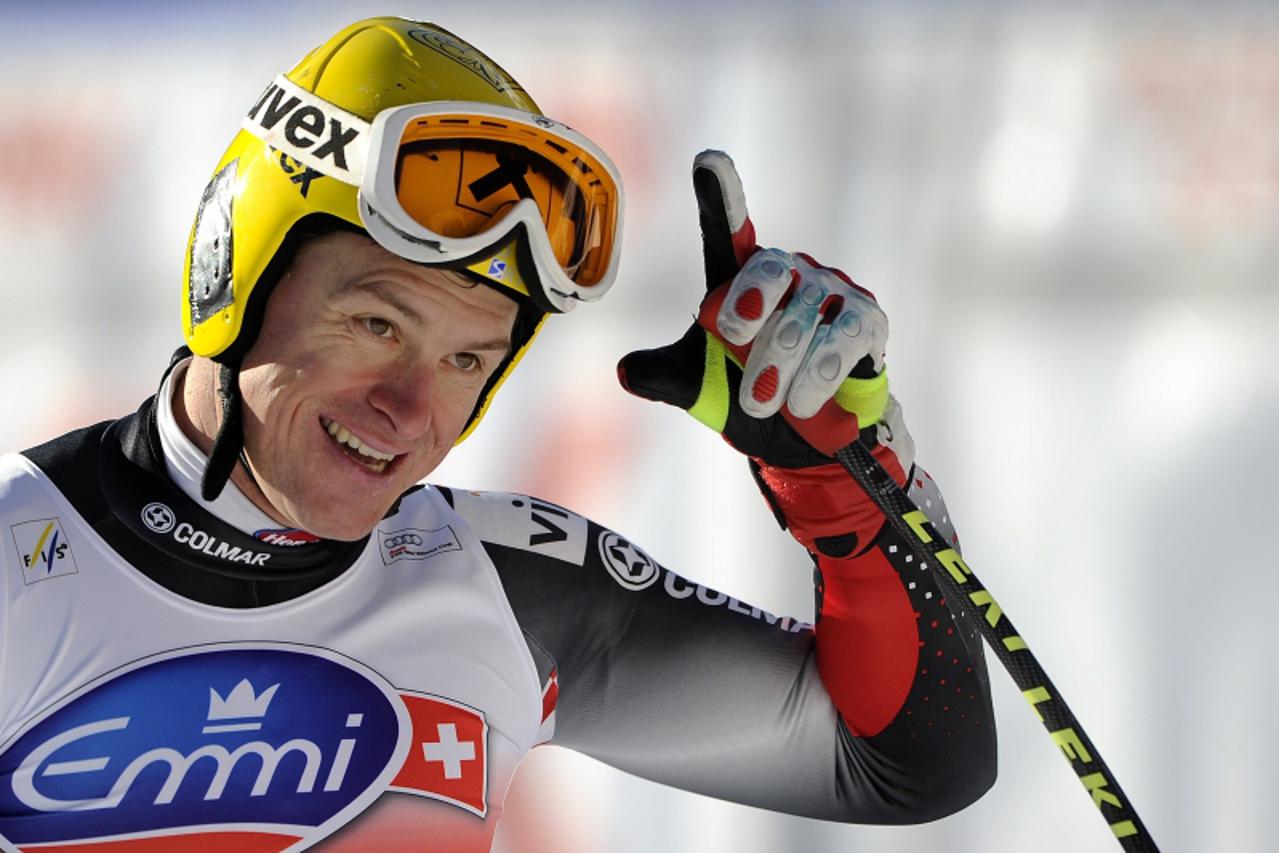 \'Croatia\'s Ivica Kostelic reacts in the arrival area of the downhill race at the FIS Alpine Skiing World Cup on January 15, 2011 in Wengen.     AFP PHOTO / FABRICE COFFRINI\'