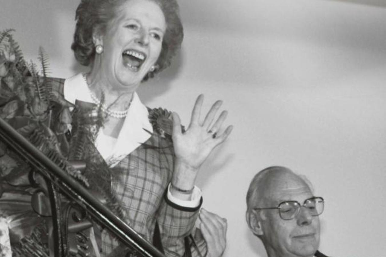 'Britain's Prime Minister Margaret Thatcher gives a jubilant wave from the stairs inside her Conservative party headquarters in London early in this June 12, 1987 file photo, after sweeping back to p