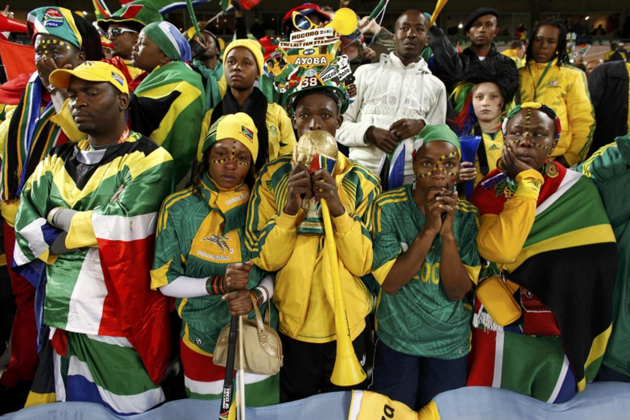 'South Africa fans react after the 2010 World Cup Group A soccer match between France and South Africa at Free State stadium in Bloemfontein June 22, 2010.     REUTERS/Jorge Silva (SOUTH AFRICA  - Tag
