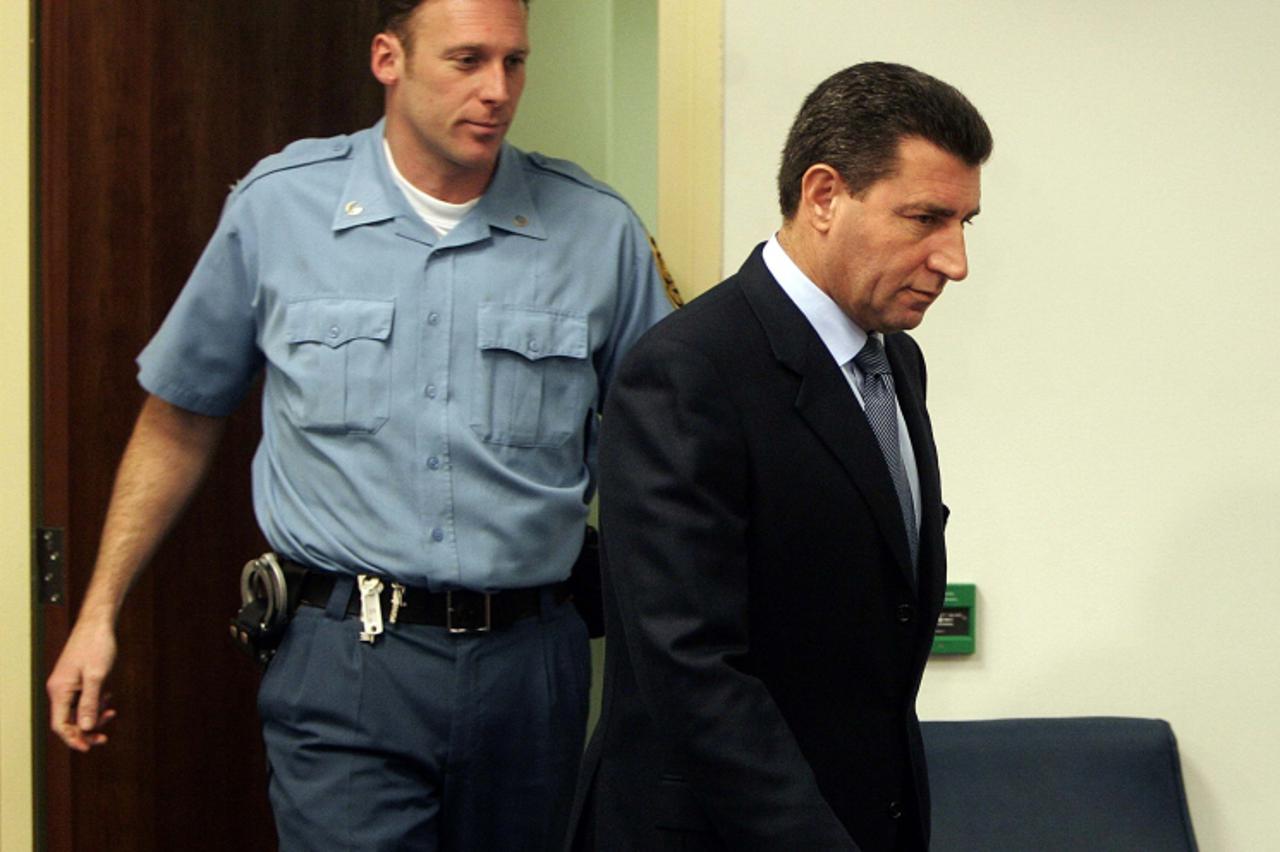 'Croatian General Ante Gotovina (R) arrives for his initial appearance at the court of the UN tribunal for warcrimes in former Yugoslavia in The Hague, Monday 12 December 2005. Ante Gotovina was to fa