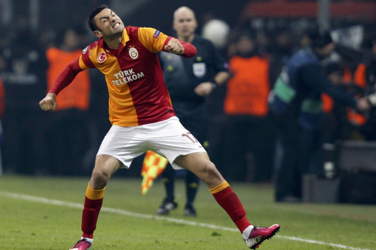 'Galatasaray\'s Burak Yilmaz celebrates his goal against Schalke 04 during their Champions League soccer match at Turk Telekom Arena in Istanbul February 20, 2013.  REUTERS/Osman Orsal (TURKEY  - Tags