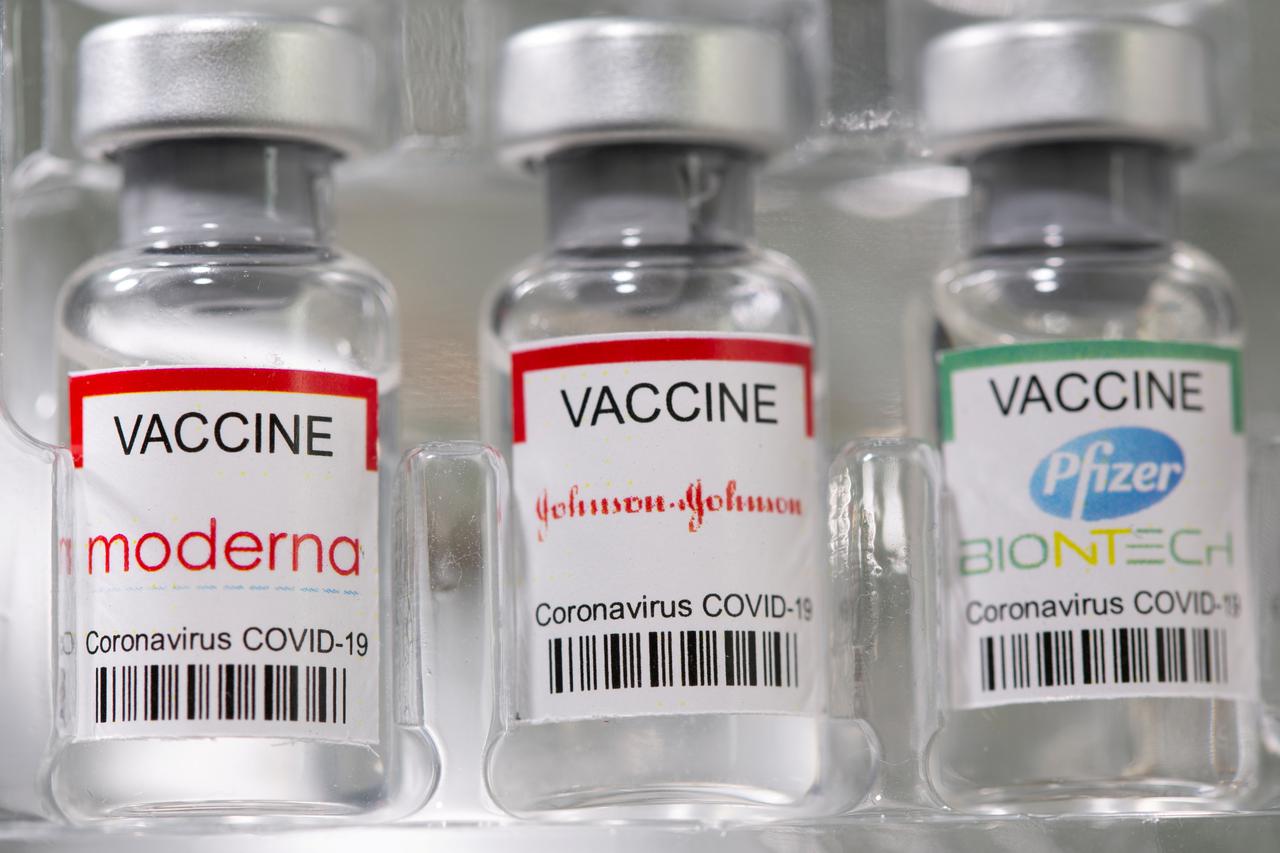 FILE PHOTO: Vials labelled "Moderna, Johnson & Johnson, Pfizer-BioNTech coronavirus disease (COVID-19) vaccine" are seen in this illustration picture