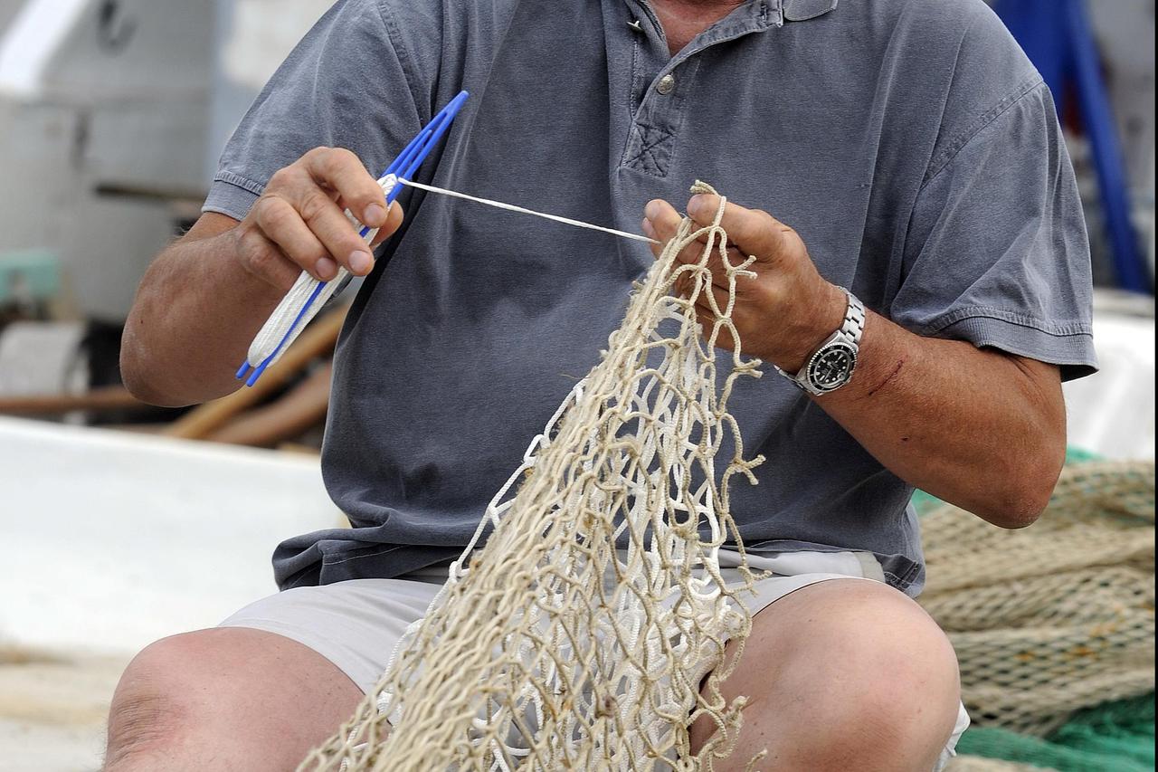 19.06.2011., Kastela - Predsjednik ceha ribara Vladan Bojic u ribarskoj luci Brizine.  