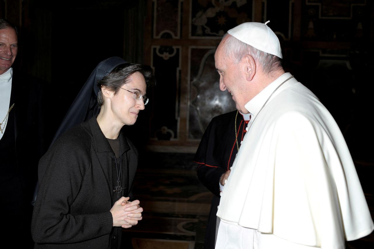 FILE PHOTO: Italian nun Sister Raffaella Petrini, who is the first woman to be appointed as the number two position in the governorship of Vatican City, is greeted by Pope Francis in this undated handout photo