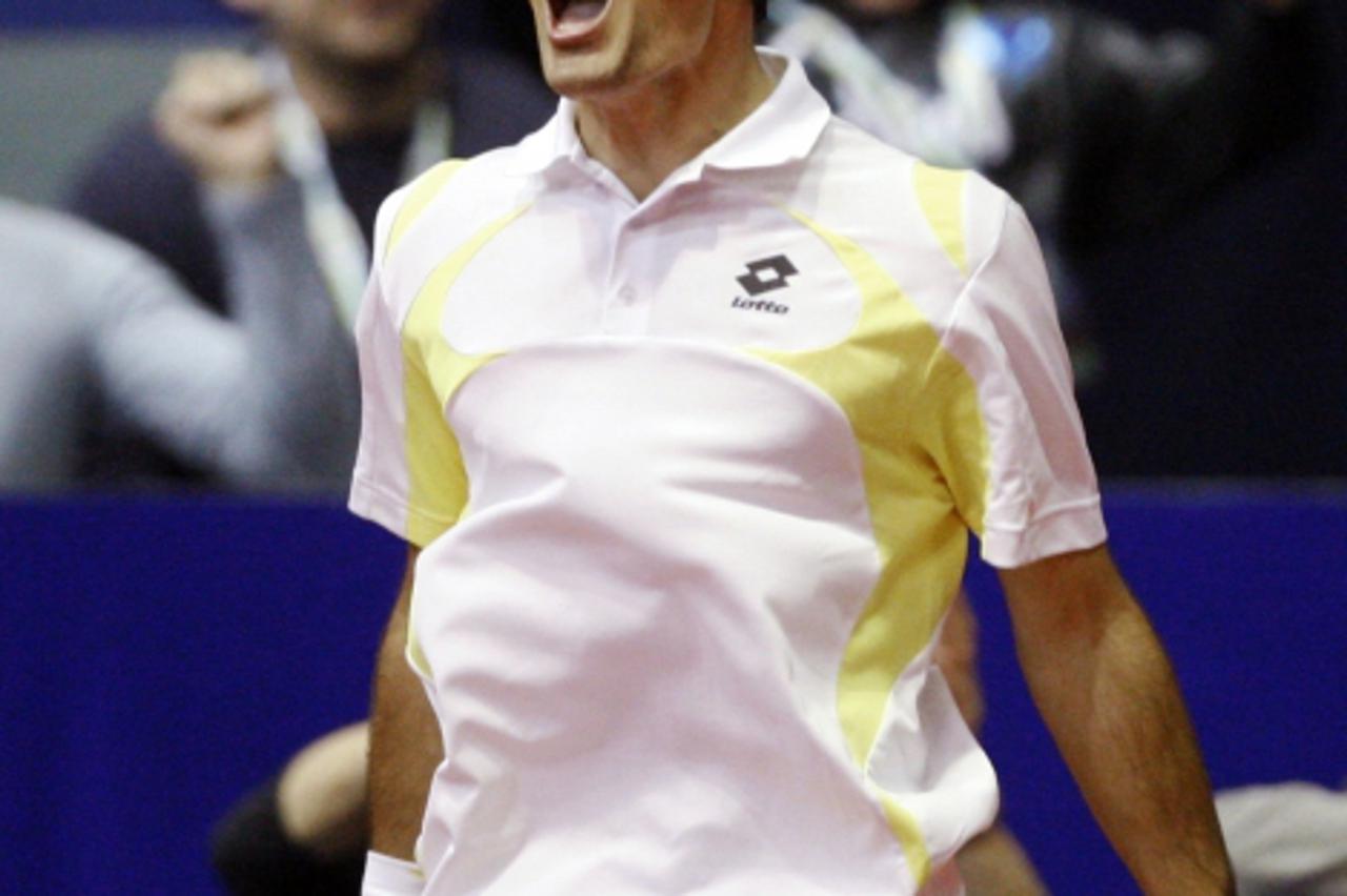 'Ivan Dodig of Croatia reacts after defeating Michael Berrer of Germany in their Zagreb Indoors ATP final tennis match in Zagreb February 6, 2011. REUTERS/Nikola Solic (CROATIA - Tags: SPORT TENNIS)'
