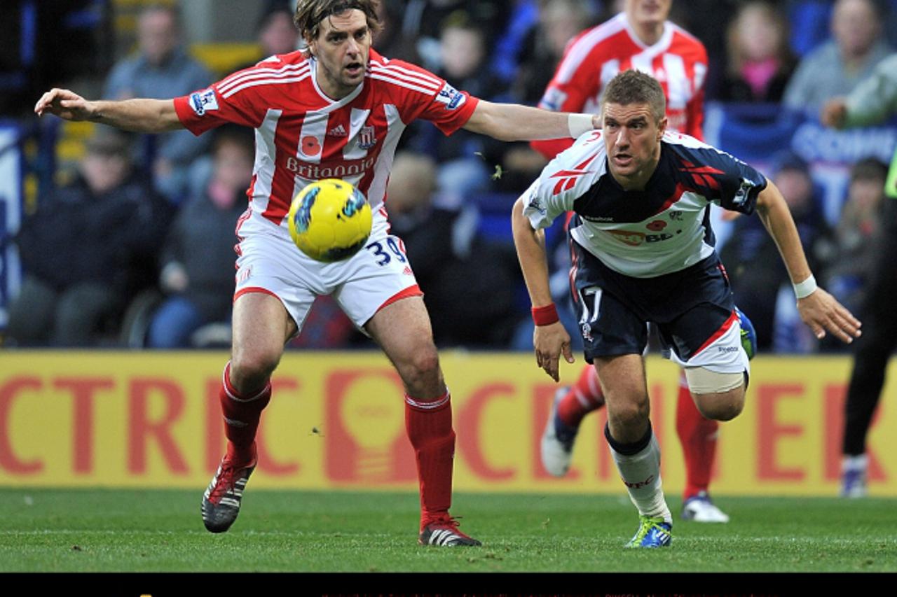 \'Bolton Wanderers\' Ivan Klasnic (right) and Stoke City\'s Jonathan Woodgate (left) battle for the ball   Photo: Press Association/Pixsell\'