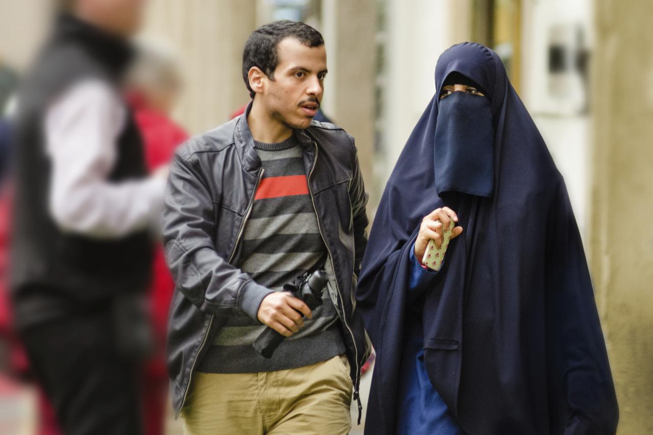 Young Muslim couple walking in Old Prague