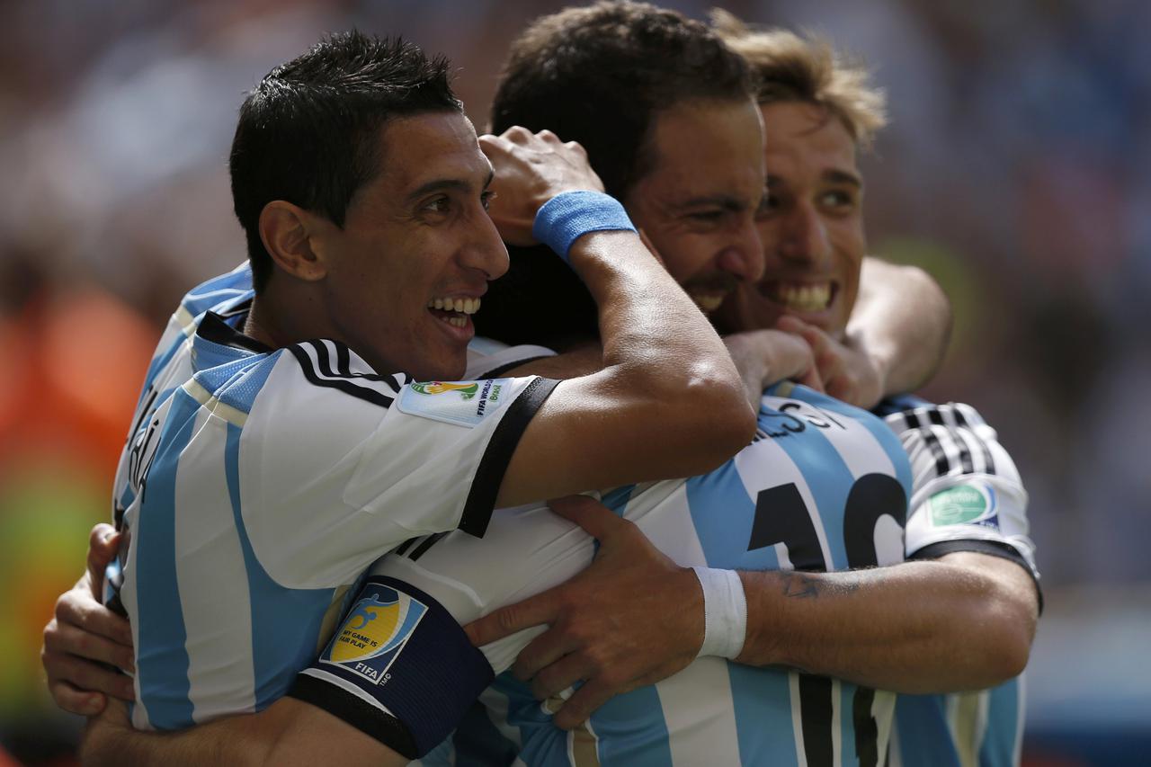 Argentina's Gonzalo Higuain (2nd R) celebrates with teammates Angel Di Maria (L), Lionel Messi (C) and Lucas Biglia after scoring a goal against Belgium during their 2014 World Cup quarter-finals at the Brasilia national stadium in Brasilia July 5, 2014. 