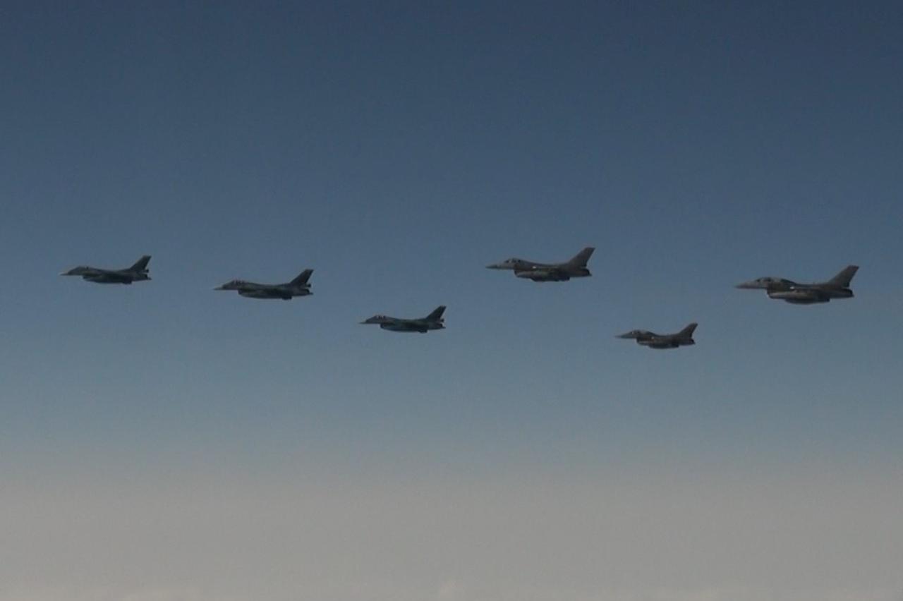 Japan Air Self-Defense Force's F-2 fighters hold a joint military drill with the U.S. F-16 fighters over Sea of Japan