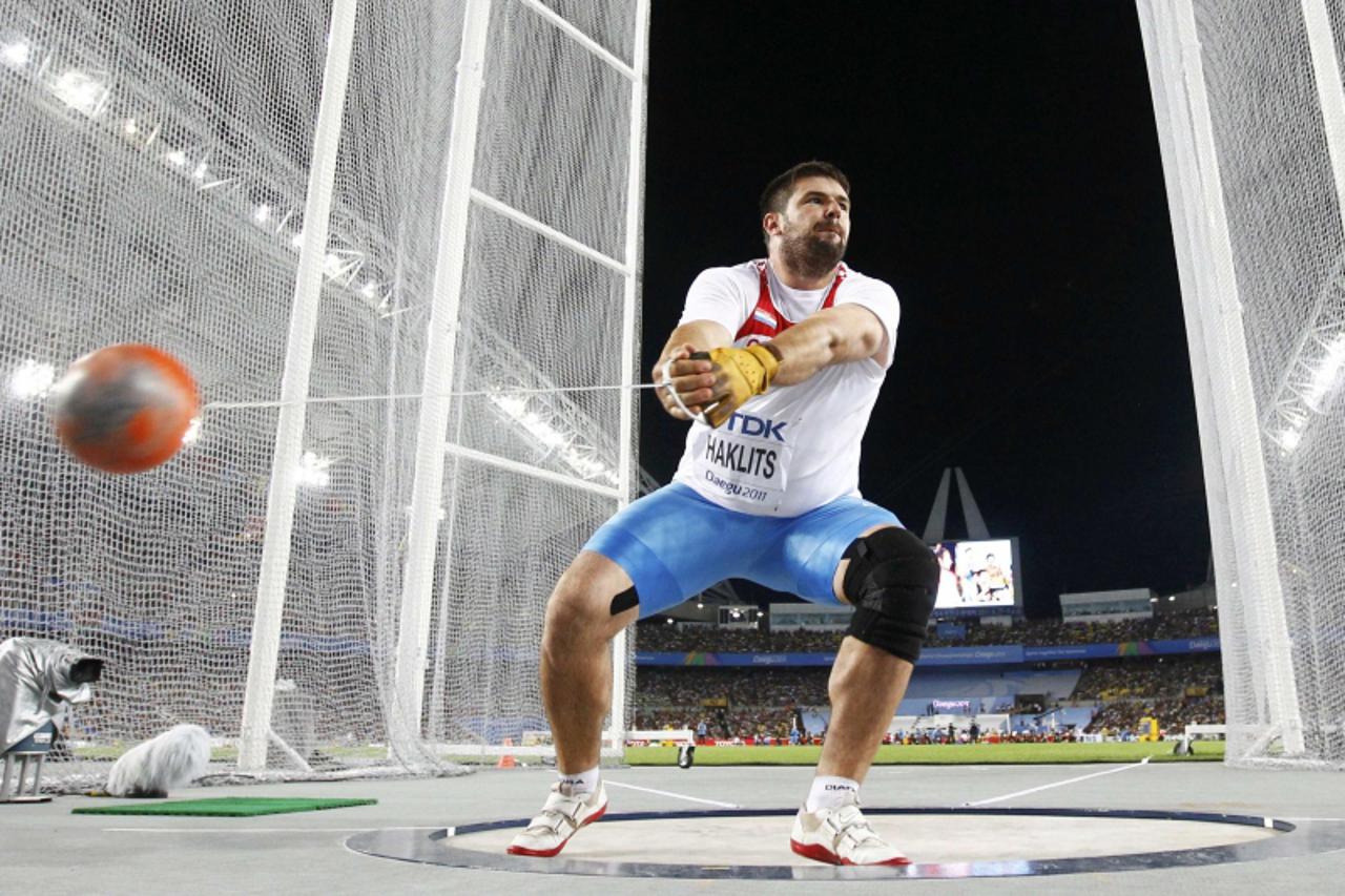'Andras Haklits of Croatia competes in the men\'s hammer throw qualifying event at the IAAF World Championships in Daegu August 27, 2011.   REUTERS/Kai Pfaffenbach (SOUTH KOREA  - Tags: SPORT ATHLETIC
