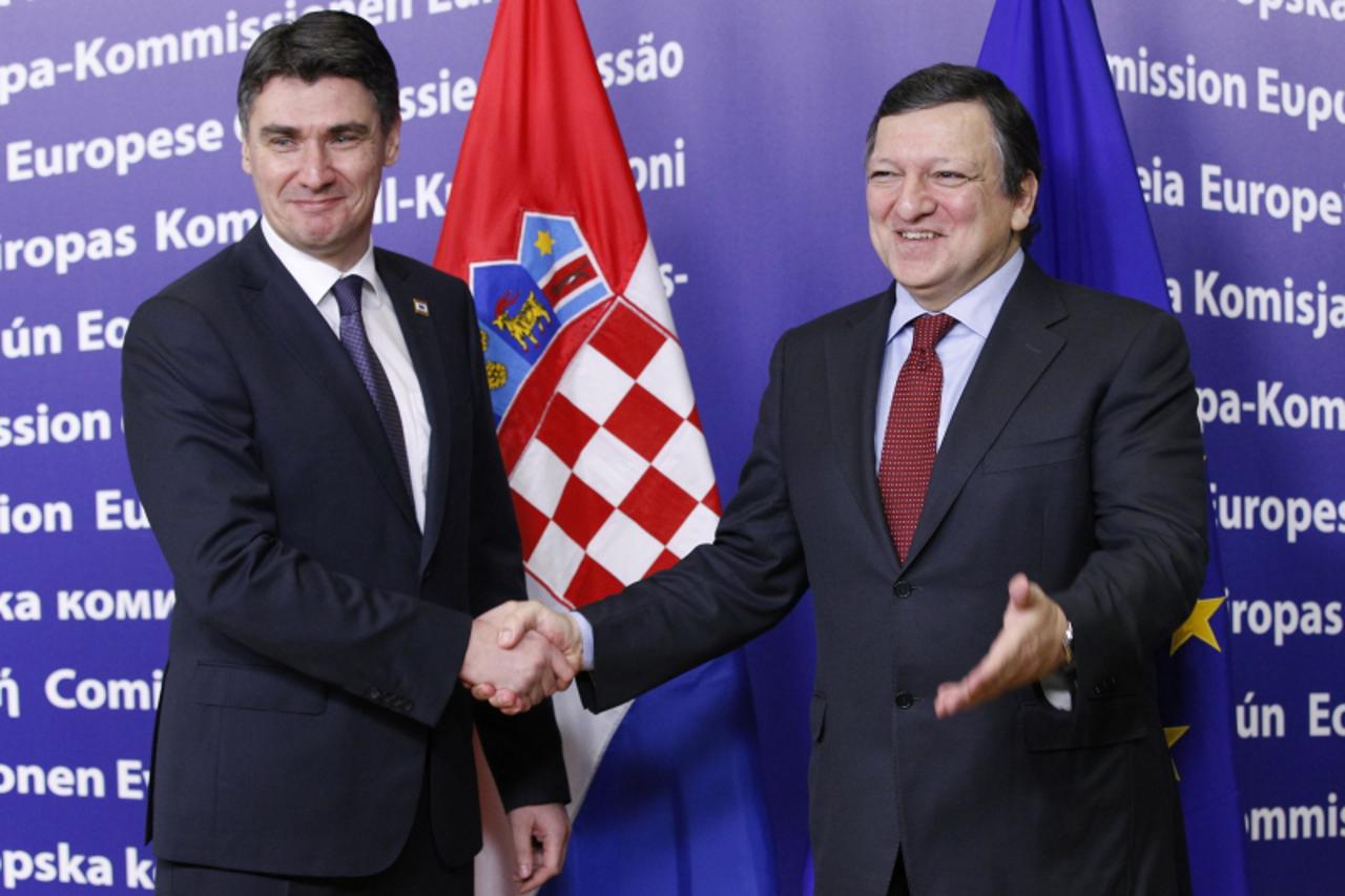 'European Commission President Jose Manuel Barroso shakes hands with Croatia\'s Prime Minister Zoran Milanovic  (L) before their meeting at the EU Commission headquarters in Brussels January 30, 2012.