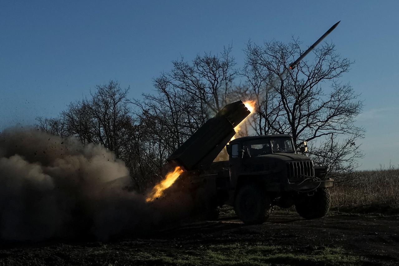 Ukrainian servicemen fire a BM-21 Grad multiple launch rocket system towards Russian troops in Donetsk region