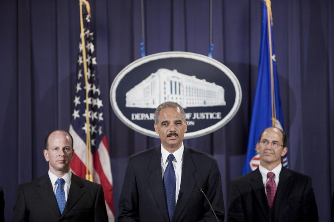 'WASHINGTON - AUGUST 5: David Kris (L), and Sean Joyce (R), FBI Executive Assistant Director for National Security Branch, listen as Attorney General Eric H. Holder Jr. speak during a press conference