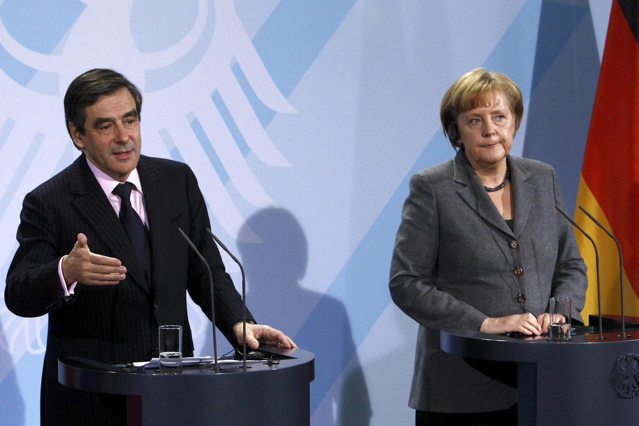 French Prime Minister Fillon and German Chancellor Merkel address a news conference following their bilateral talks at the chancellery in Berlin French Prime Minister Francois Fillon and German Chancellor Angela Merkel address a news conference following 