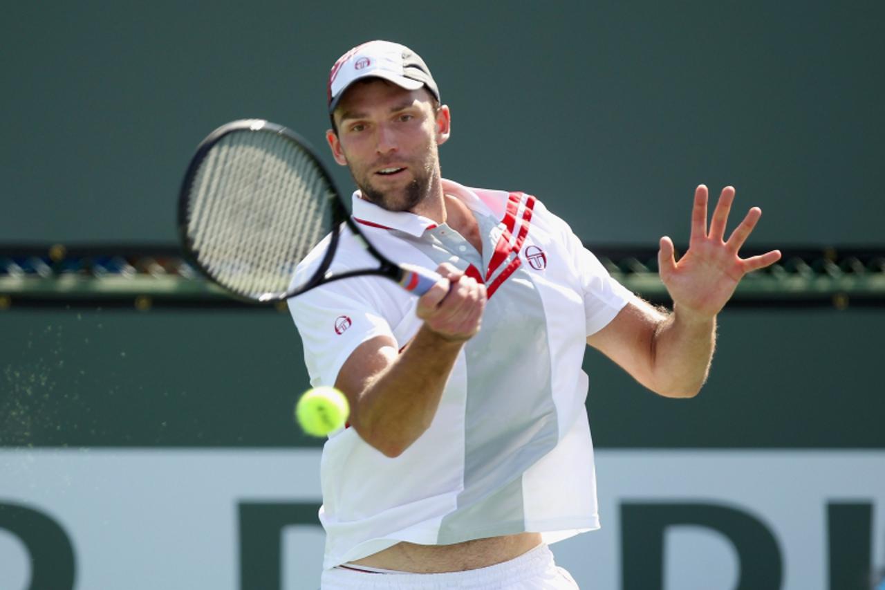 'INDIAN WELLS, CA - MARCH 12: Ivo Karlovic of Crotaia returns a shot to David Ferrer of Spain during the BNP Paribas Open at the Indian Wells Tennis Garden on March 12, 2011 in Indian Wells, Californi