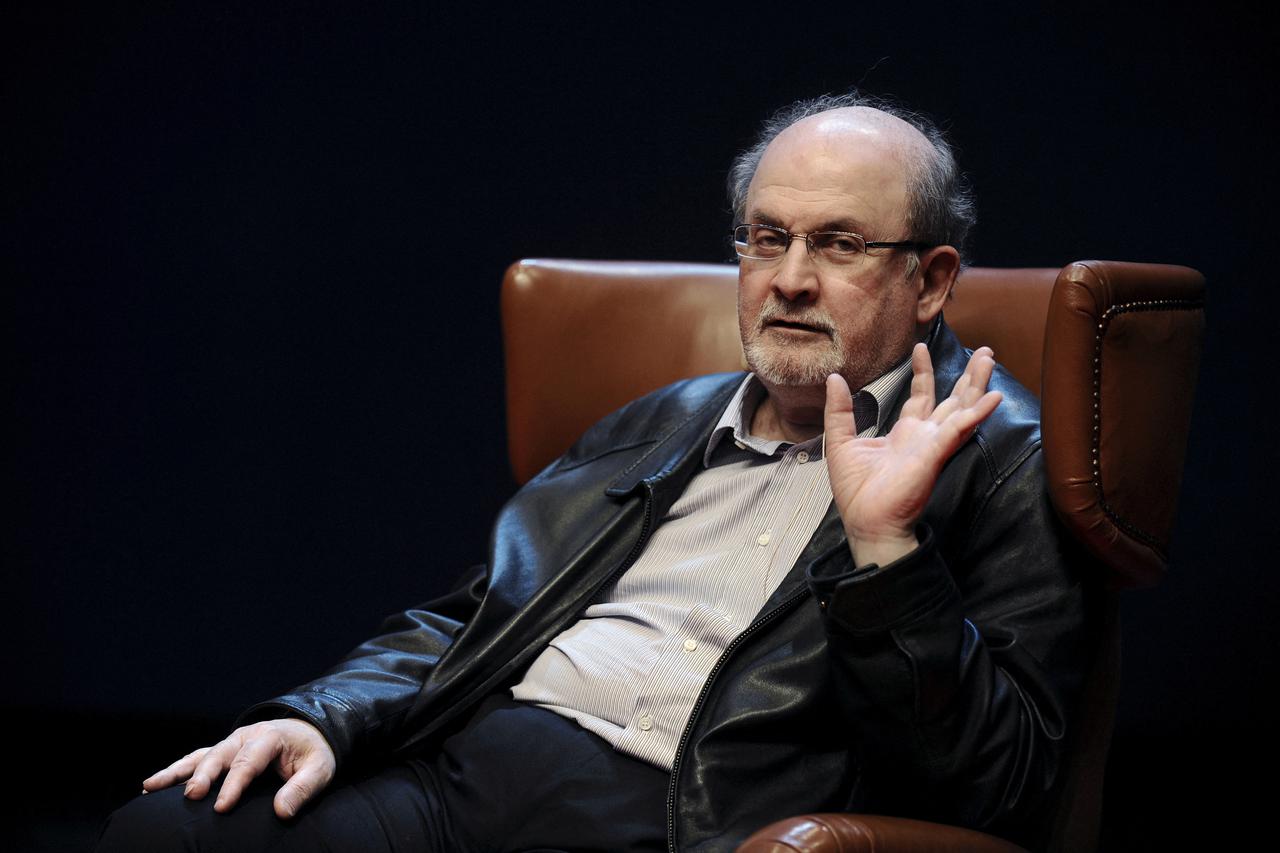 FILE PHOTO: Author Rushdie gestures during a news conference before the presentation of his latest book 'Two Years Eight Months and Twenty-Eight Nights' at the Niemeyer Center in Aviles