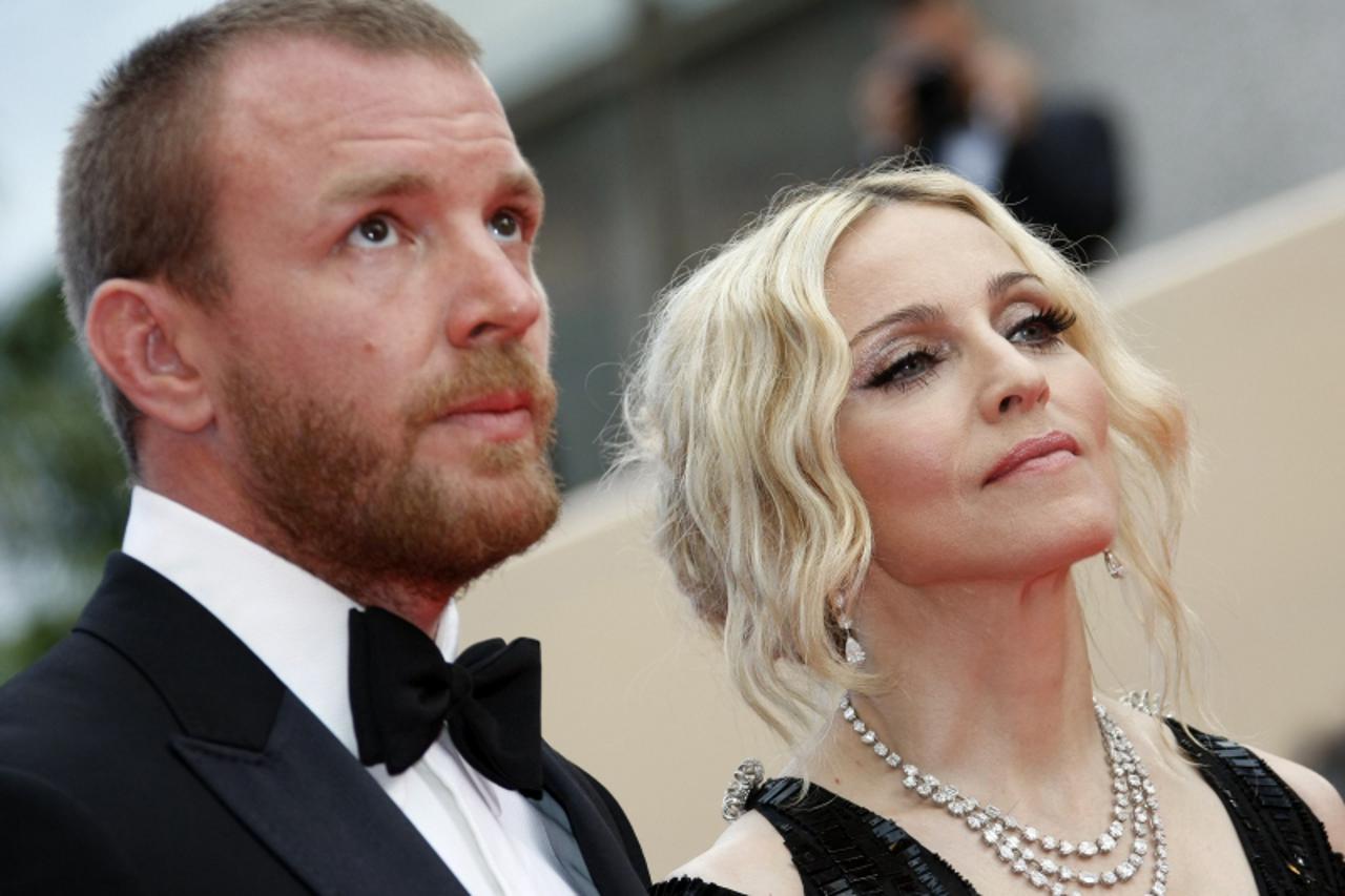 'RNPS IMAGES OF THE YEAR 2008    Singer Madonna and director husband Guy Ritchie arrive on the red carpet at the 61st Cannes Film Festival May 21, 2008.     REUTERS/Eric Gaillard  (FRANCE)'