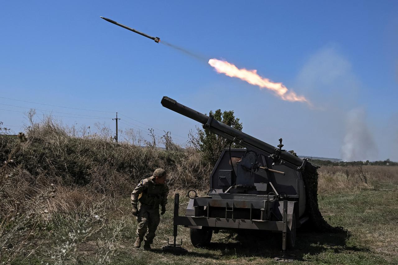 FILE PHOTO: Ukrainian servicemen fire small MLRS toward Russian troops near a front line in Zaporizhzhia region