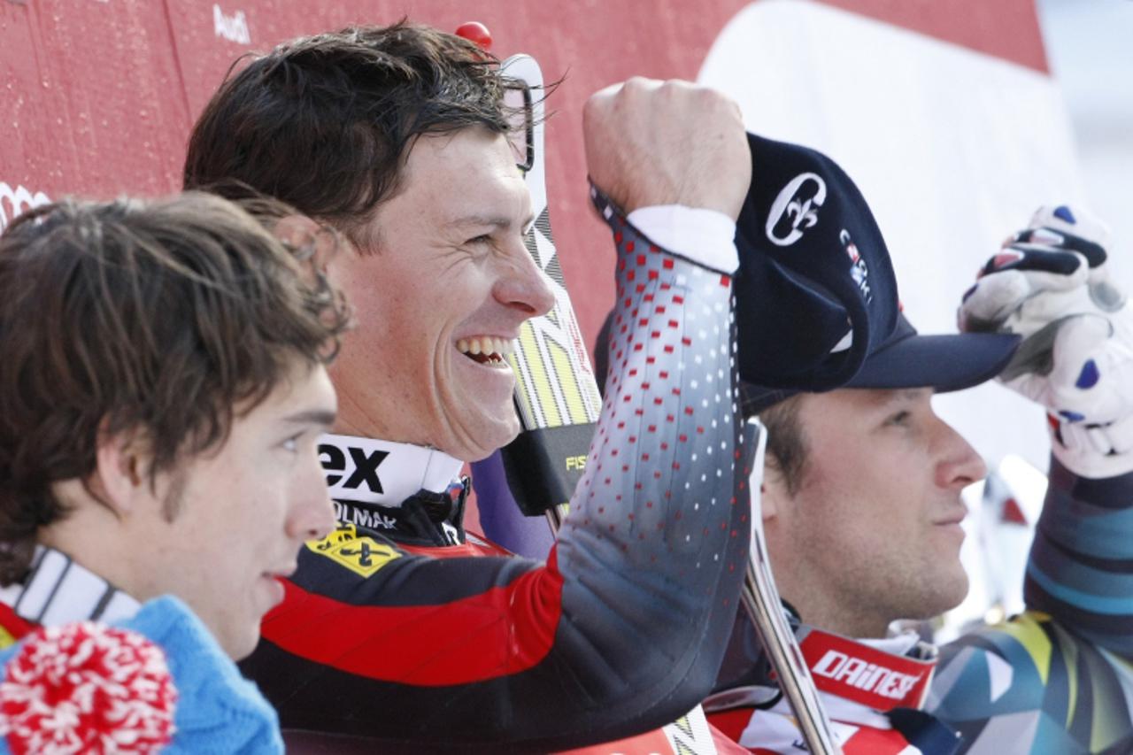 \'Winner Ivica Kostelic of Croatia (C), second placed Carlo Janka of Switzerland (L) and third placed Lund Aksel Svindal celebrate on the podium after the men\'s Alpine skiing World Cup Super combined