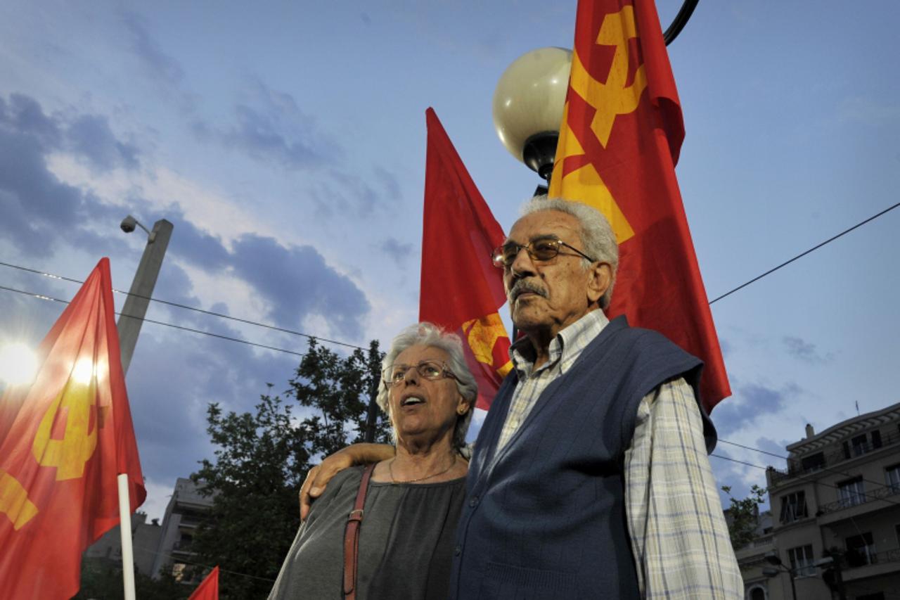 'An elderly couple attends a Greek Communist Party rally calling for Greece\'s exit from the Eurozone, on May 14, 2012.  The Greek president today proposed forming a technocrat government and called f