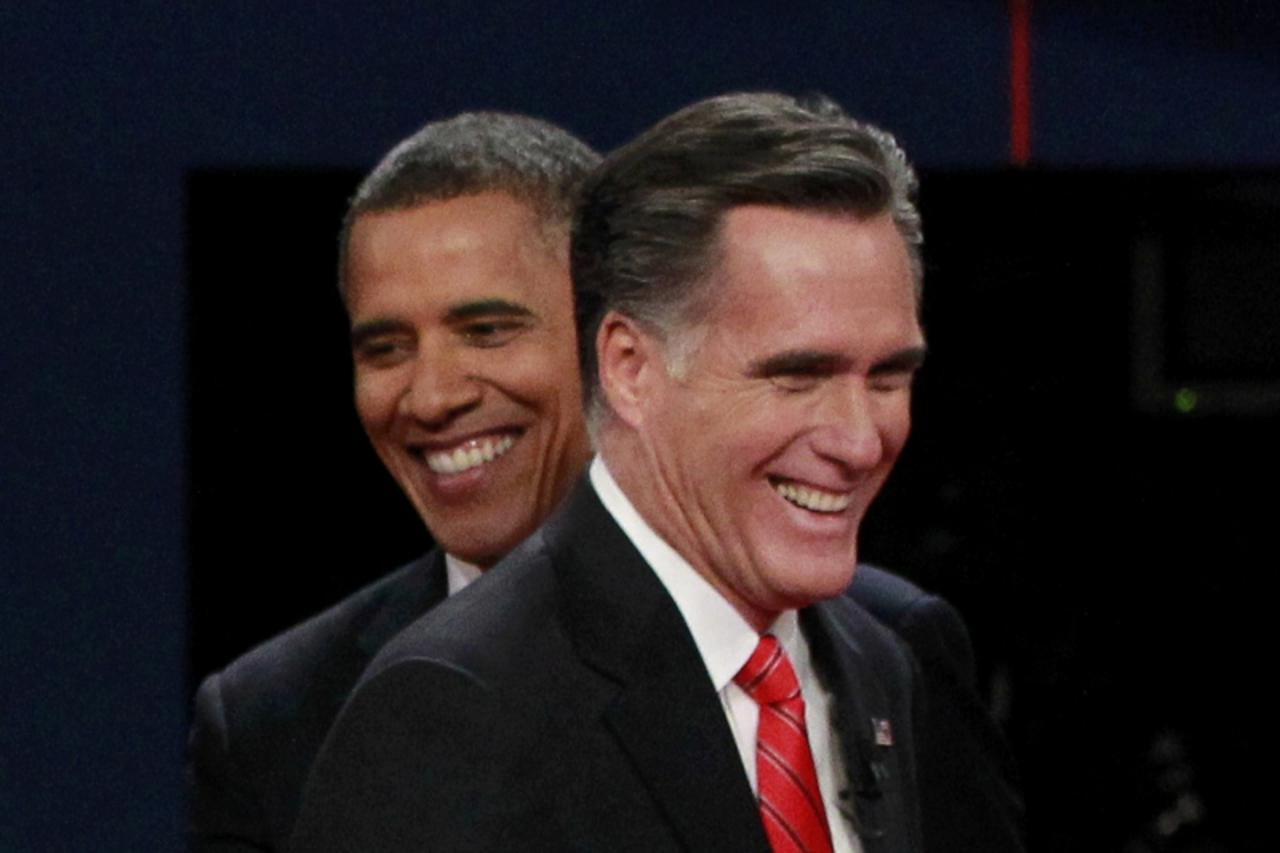 'President Barack Obama (L) and Republican presidential nominee Mitt Romney share a laugh at the end of the first presidential debate in Denver October 3, 2012.       REUTERS/Jason Reed (UNITED STATES