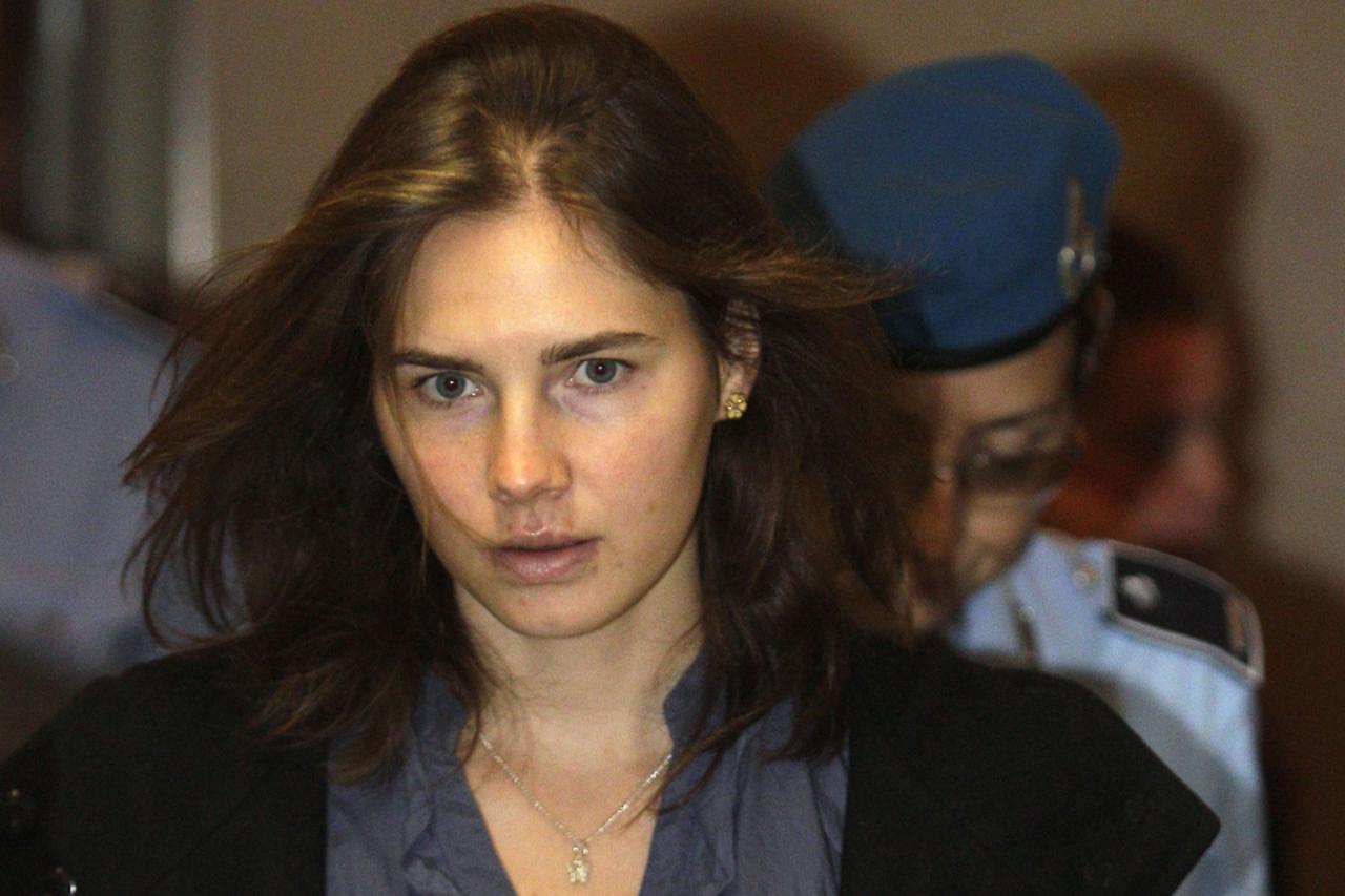 'Amanda Knox (L), the U.S. student convicted of murdering her British flatmate Meredith Kercher in Italy in November 2007, arrives at the court during her appeal trial session in Perugia September 30,