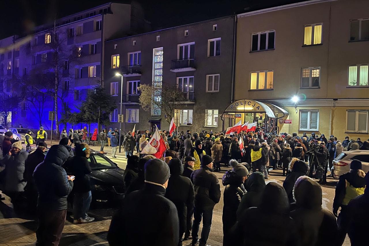 Protesters gather in support of former Interior Minister Kaminski and his deputy Wasik from PiS party, in front of the police station were both politicians are detained in Warsaw