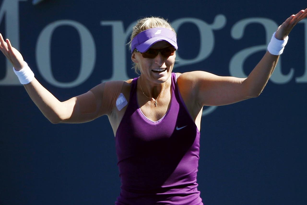 Mirjana Lucic-Baroni of Croatia raects after defeating Simona Halep of Romania during their match at the 2014 U.S. Open tennis tournament in New York, August 29, 2014.  REUTERS/Adam Hunger (UNITED STATES  - Tags: SPORT TENNIS)