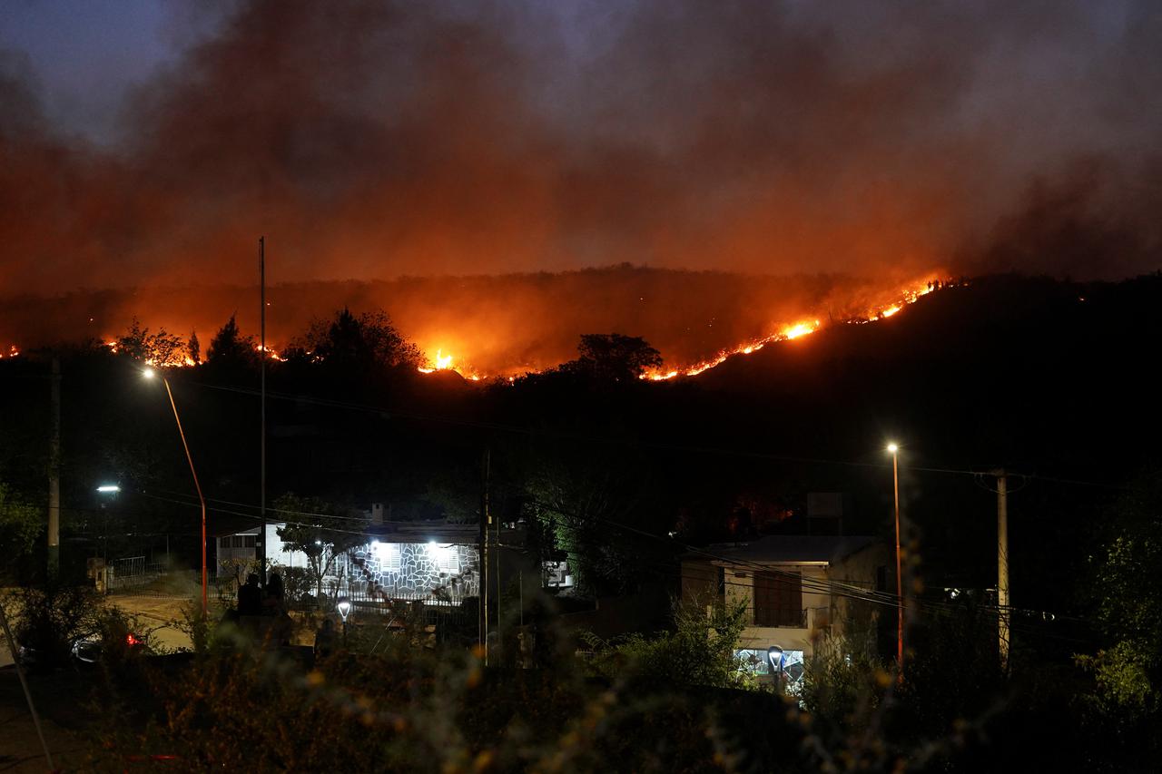 A view shows a wildfire, that has forced the evacuation of residents, in Villa Carlos Paz
