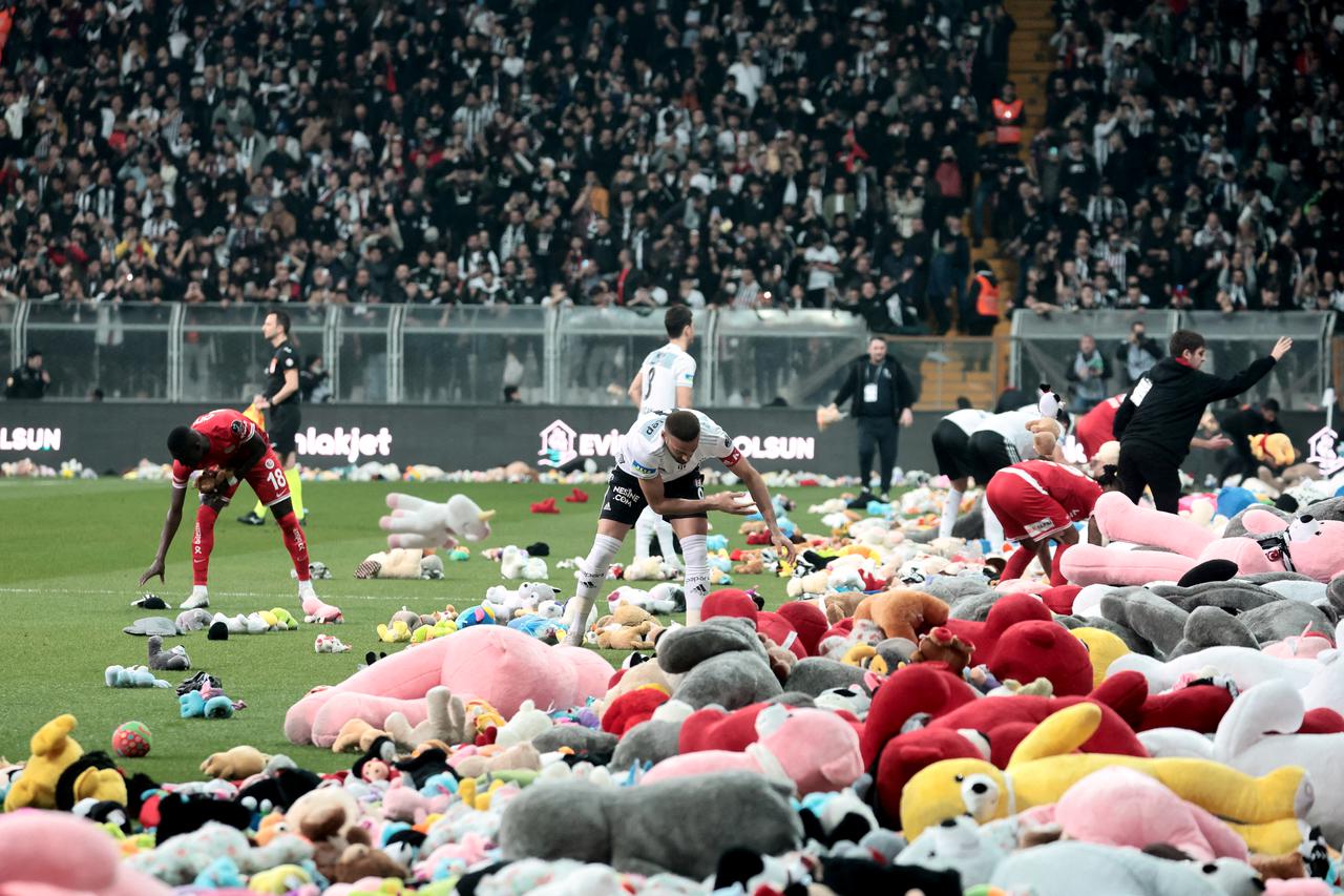 Besiktas Fans Throw Toys Onto The Field For Quake Survivor Children