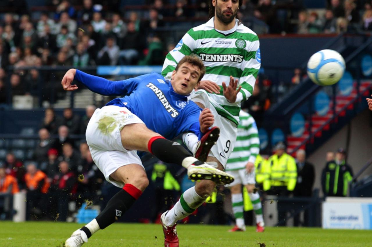 \'Rangers\' Nikica Jelavic attempts a shot at goal during their CIS Cup final soccer match against Celtic at Hampden Park stadium in Glasgow, Scotland March 20, 2011. REUTERS/David Moir (BRITAIN - Tag