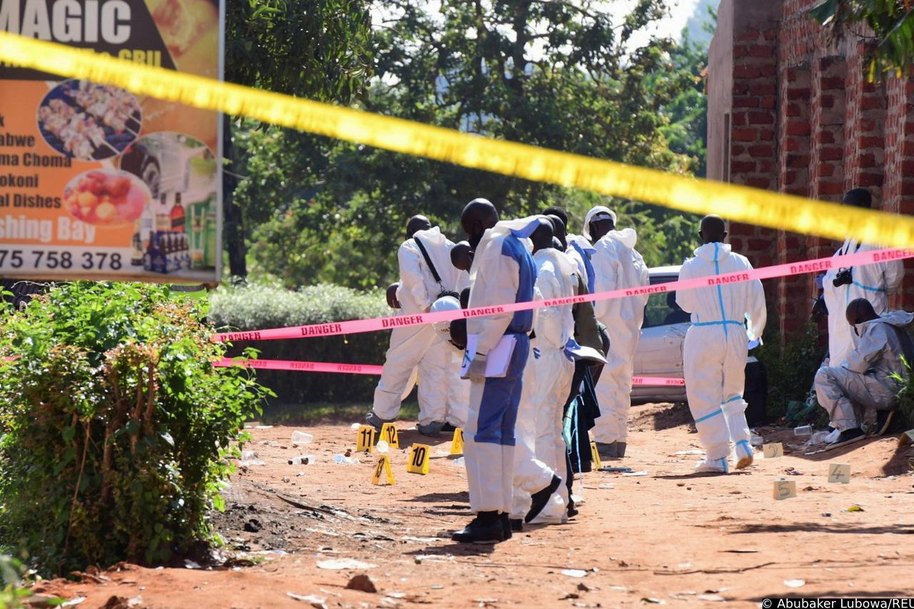 Ugandan explosives experts secure the scene of an explosion in Komamboga, on the northern outskirts of Kampala