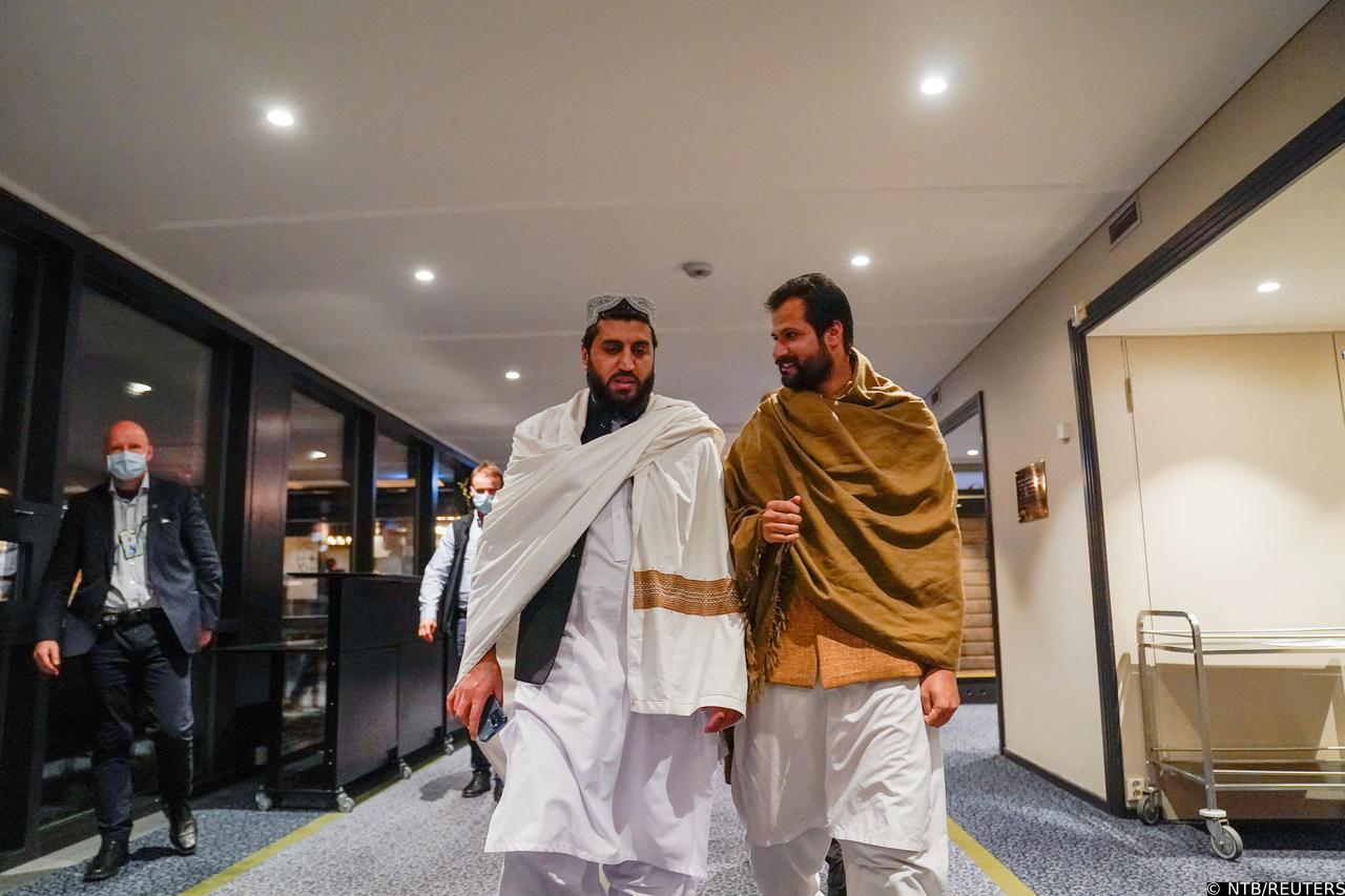 Representatives of the Taliban walk at the Soria Moria hotel, in Oslo