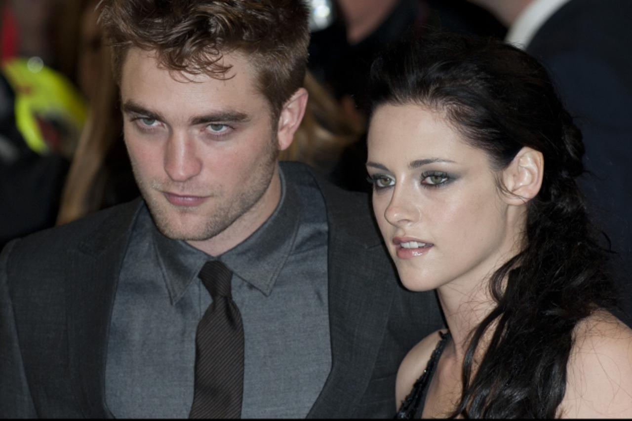 'Robert Pattinson and Kristen Stewart arriving for the UK premiere of The Twilight Saga: Breaking Dawn Part 1, at the Westfield Stratford City, Stratford, London. Photo: Press Association/Pixsell'